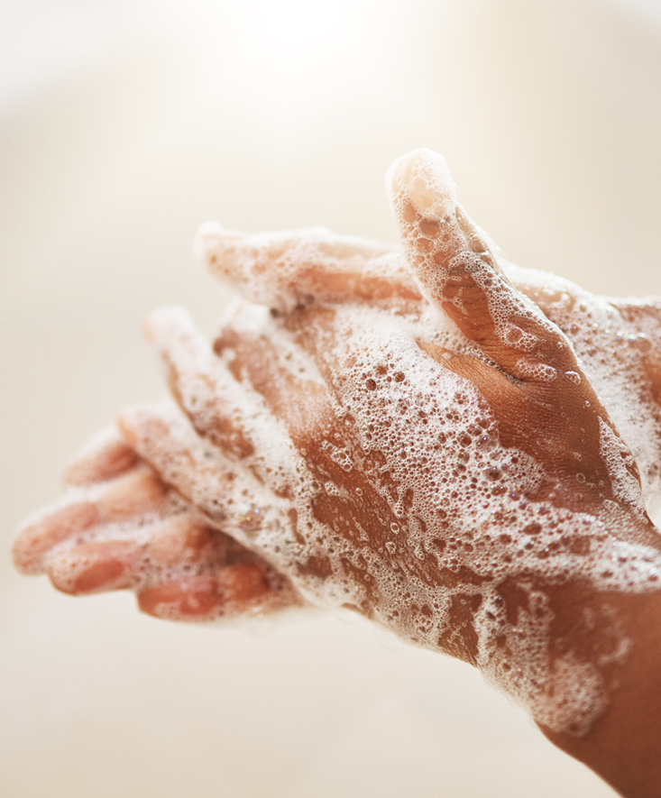 Hands being washed thoroughly