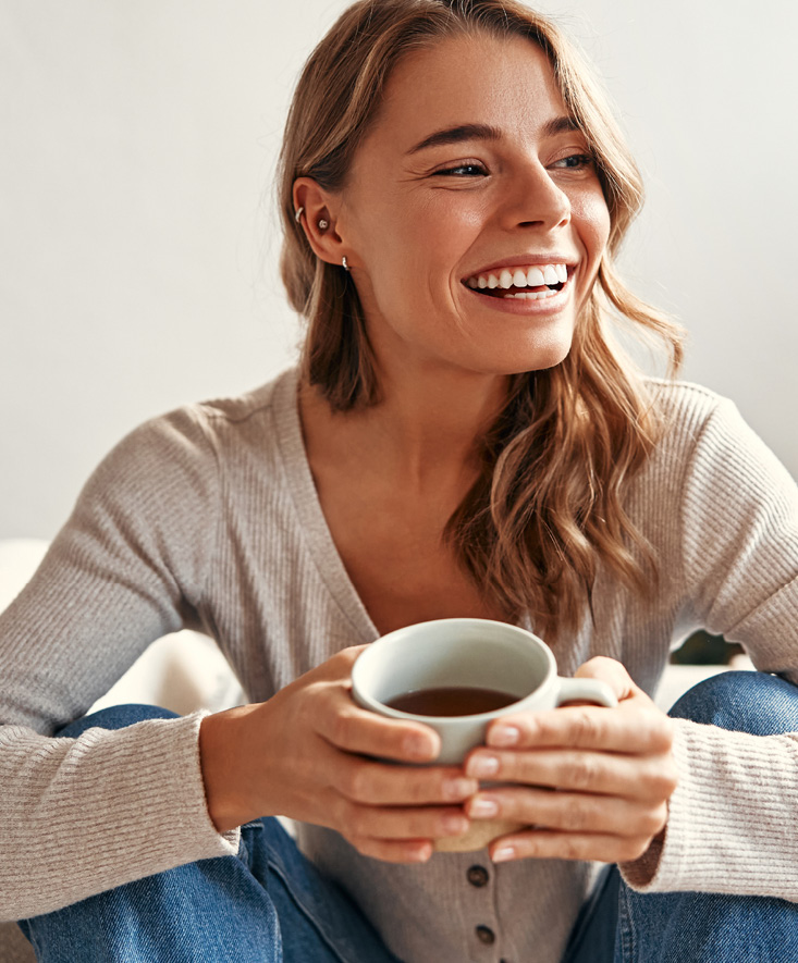 A patient relaxing with a warm drink